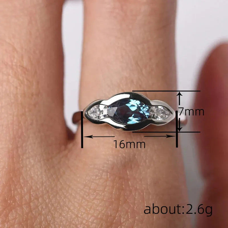 Geometric ellipse zircon ring in white gold colour on copper base