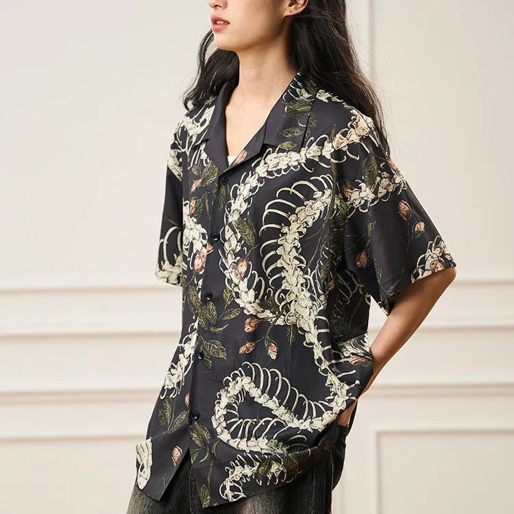 Short sleeve loose fit Cuban collar shirt with a printed snake bone pattern design in a colour option.