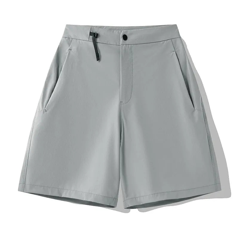Man wearing khaki quick-drying sports shorts with a 3D cut, suitable for running.