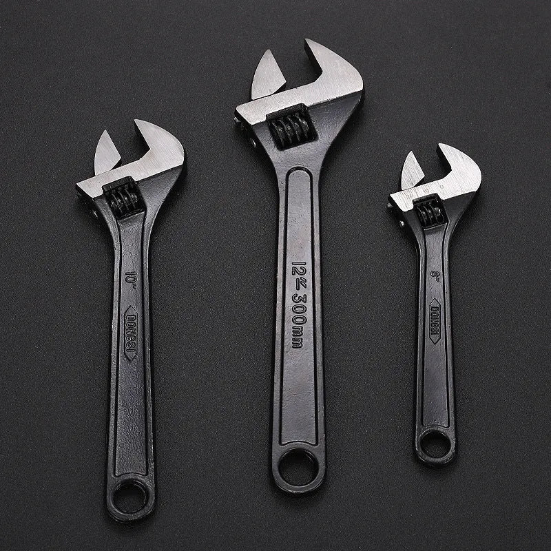 10-inch black high carbon steel adjustable open-end wrench on a workbench
