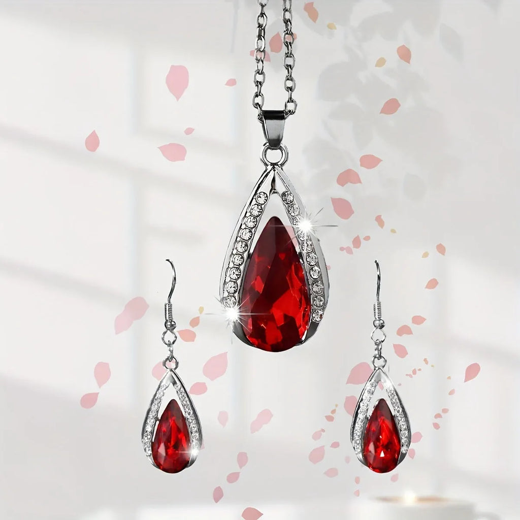 Teardrop pendant necklace and matching earrings jewellery suite in alloy with black or red glass accents