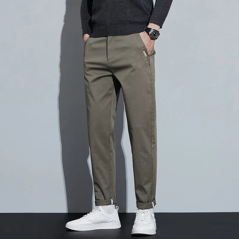 Men combed cotton light business casual trousers in black, side view showing mid-waist cut and fabric texture