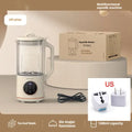 Automatic soya milk maker with glass jug in milky white colour on a kitchen countertop.