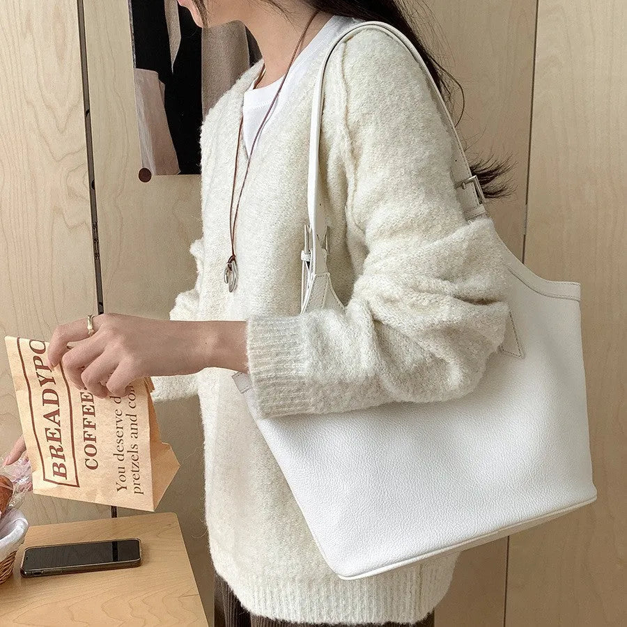 Idle Style light retro PU soft leather large capacity commuter shoulder bag in black with bucket shape and double straps