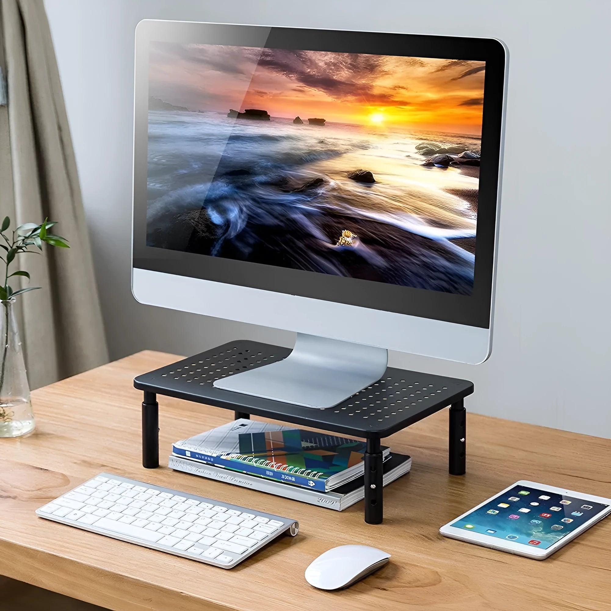 Black mesh iron display stand with three adjustable height settings for monitors and laptop cooling