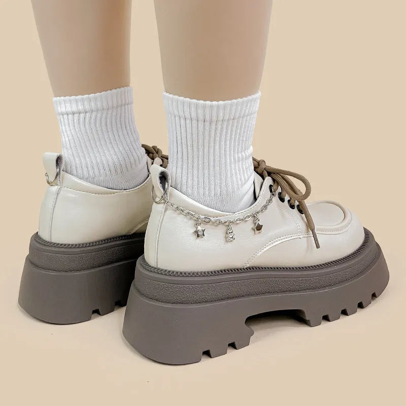 White women's platform Mary Jane shoes with round toe, front lace-up, and a chunky heel