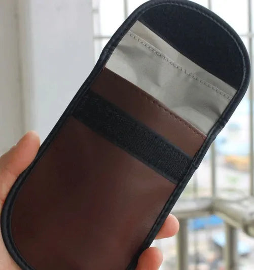 Black microfiber faraday bag for blocking car key fob and RFID card signals.