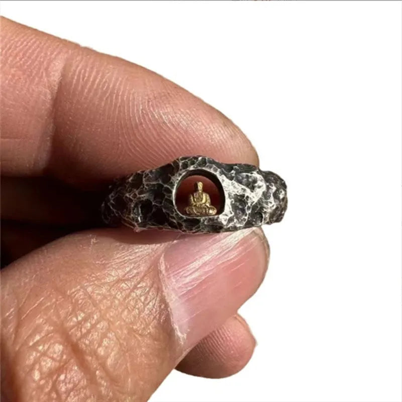 Close-up of a hand-forged copper Buddha ring with a grotto rock texture, shown in size UK 8.