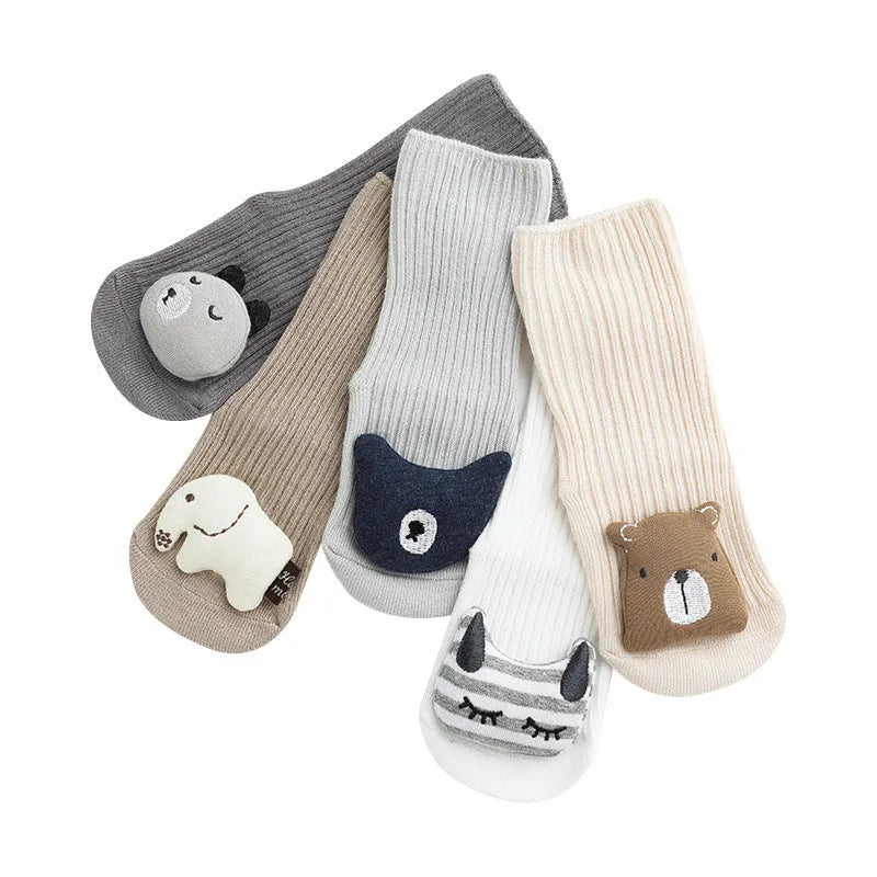 Baby socks with anti-slip dispensing glue in combed cotton, shown in multiple colours including blue bear print and pink cat.