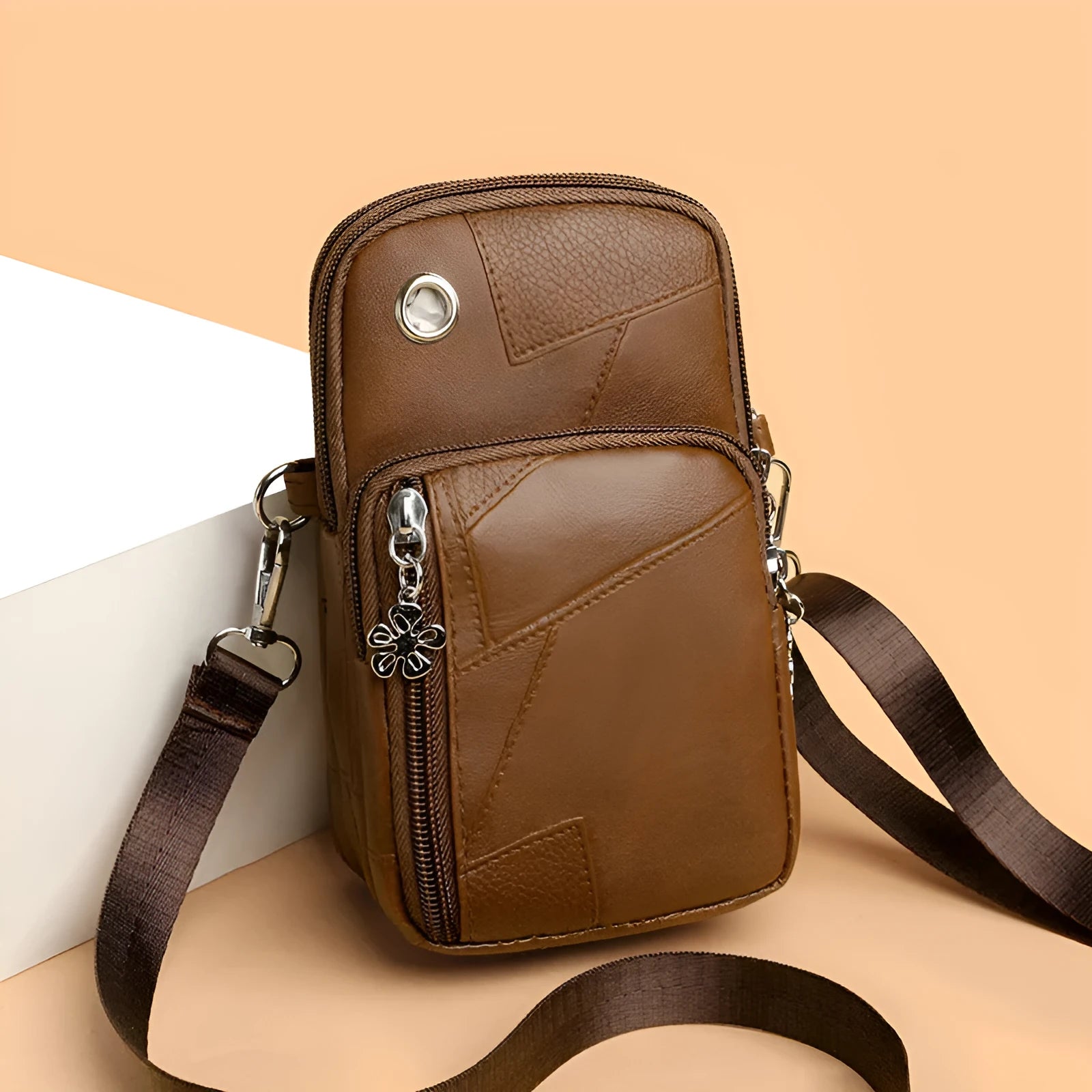 Vertical mini phone bag in square shape with sandwich pocket, shown in brown colour option