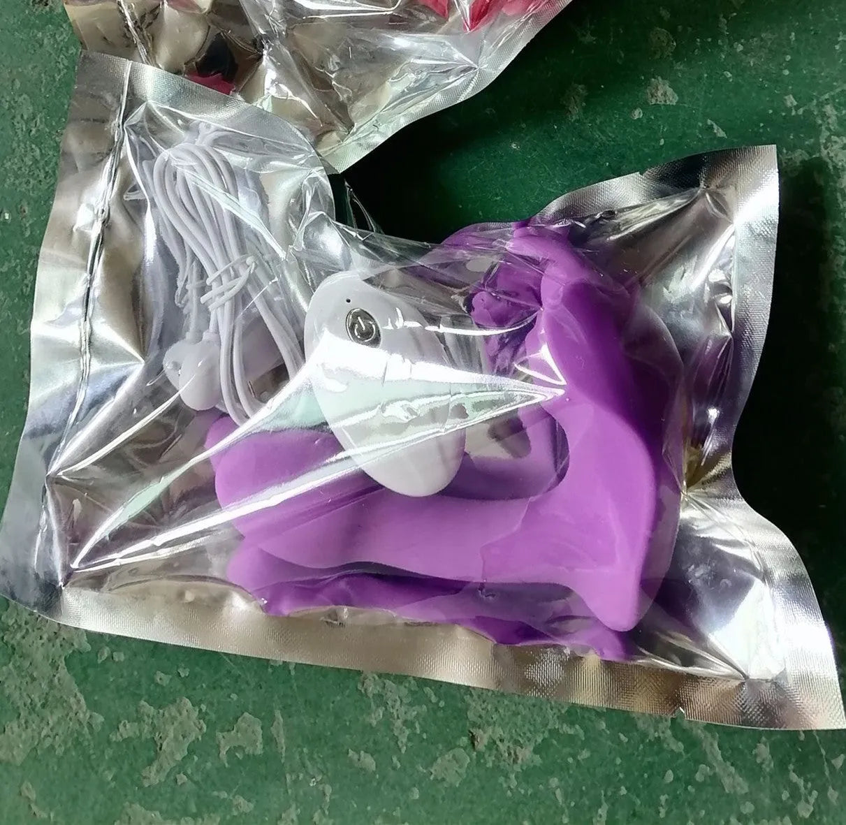 Purple silicone butterfly vibrator with remote control and USB cable