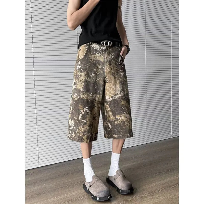 Yellow snake pattern camouflage cropped jeans on hanger showing cotton denim fabric
