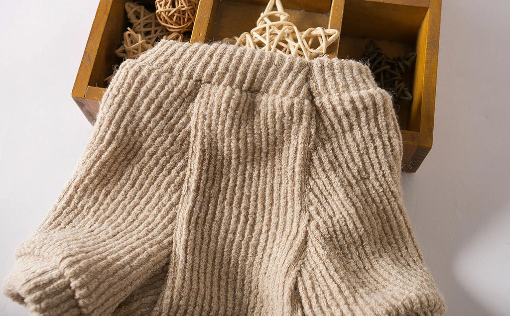 Brown cloth pullover sweater on a small dog, showing casual design and comfortable fit.