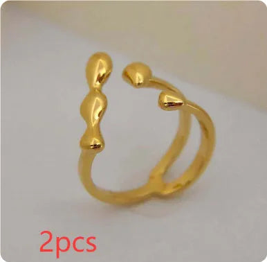 Adjustable brass ring with sphere design in gold or silver plating.