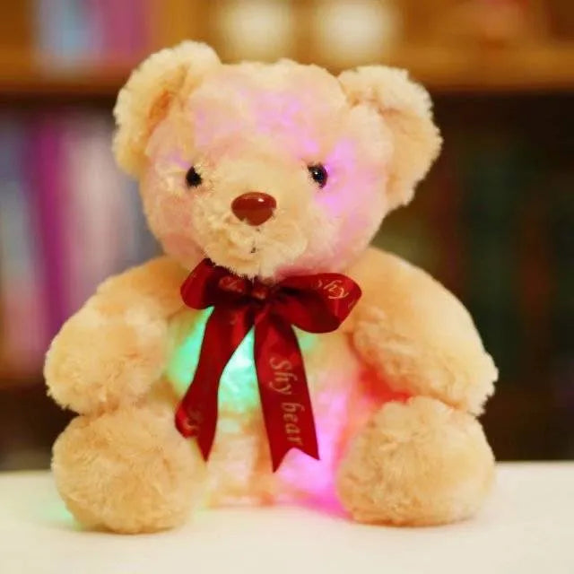 Plush teddy bear with glow feature in brown colour, sitting at 25 cm height