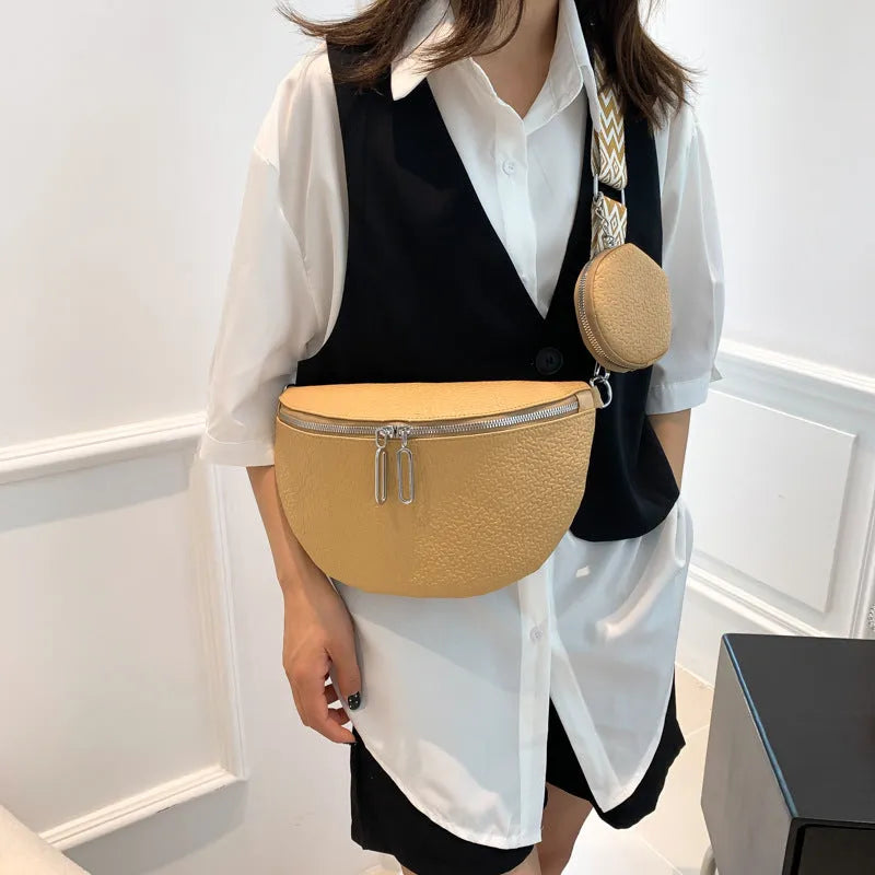 Solid colour women's crossbody bag with horizontal square clamshell design and zip closure