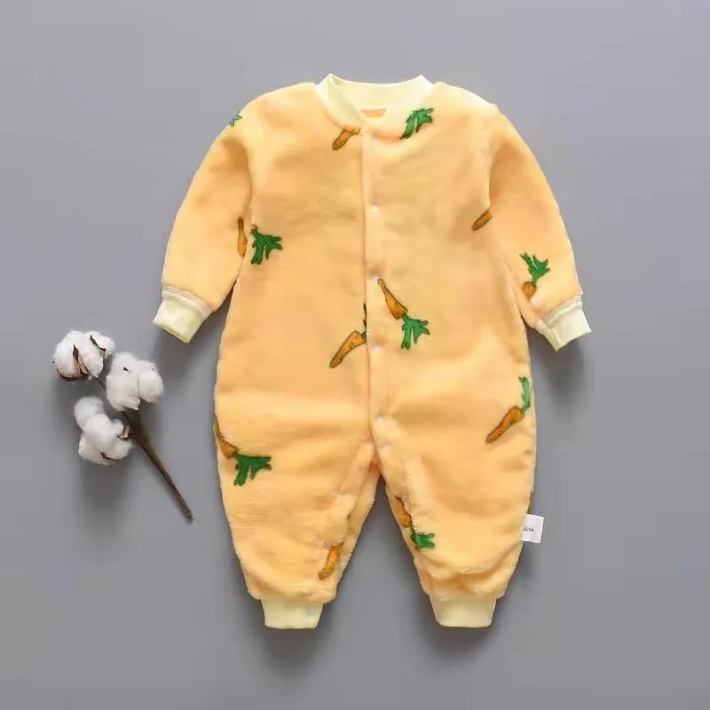Baby wearing a long-sleeved flannel romper in a pink bunny head print, showcasing the 100% cotton fabric.