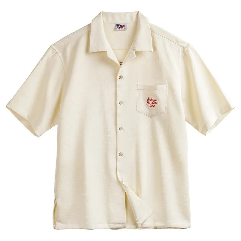Light apricot men's shirt with bamboo pattern and Cuban collar shown on hanger