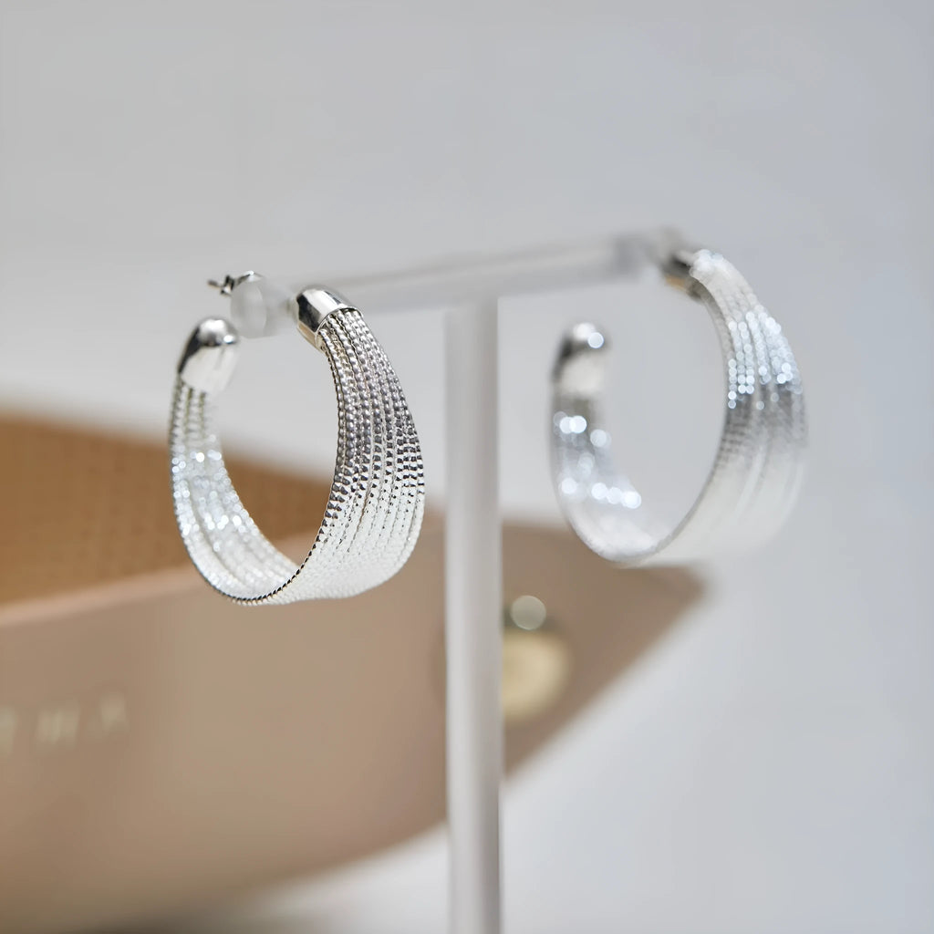 Geometric layered bracelet earrings with matching stud and clip earrings in gold or silver finishes
