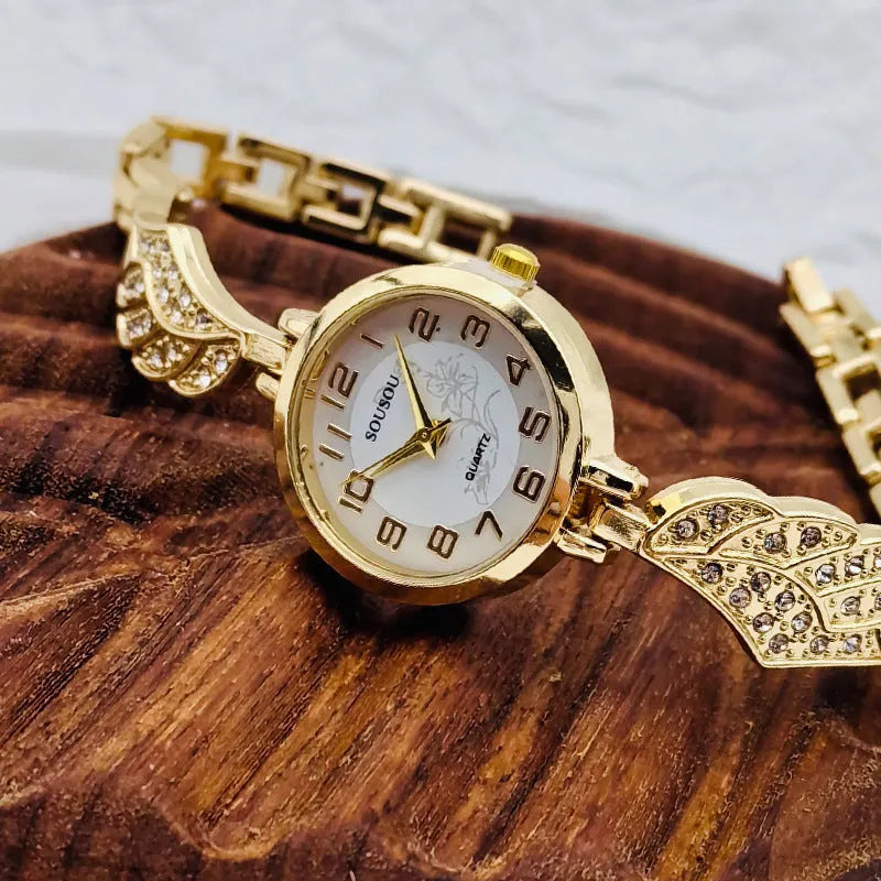 Stainless steel women's wristwatch with round dial on a metal bracelet with Vachette clasp.