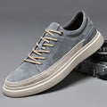 Men's grey pigskin leather casual skate shoes with round toe and flat rubber sole on a light background.