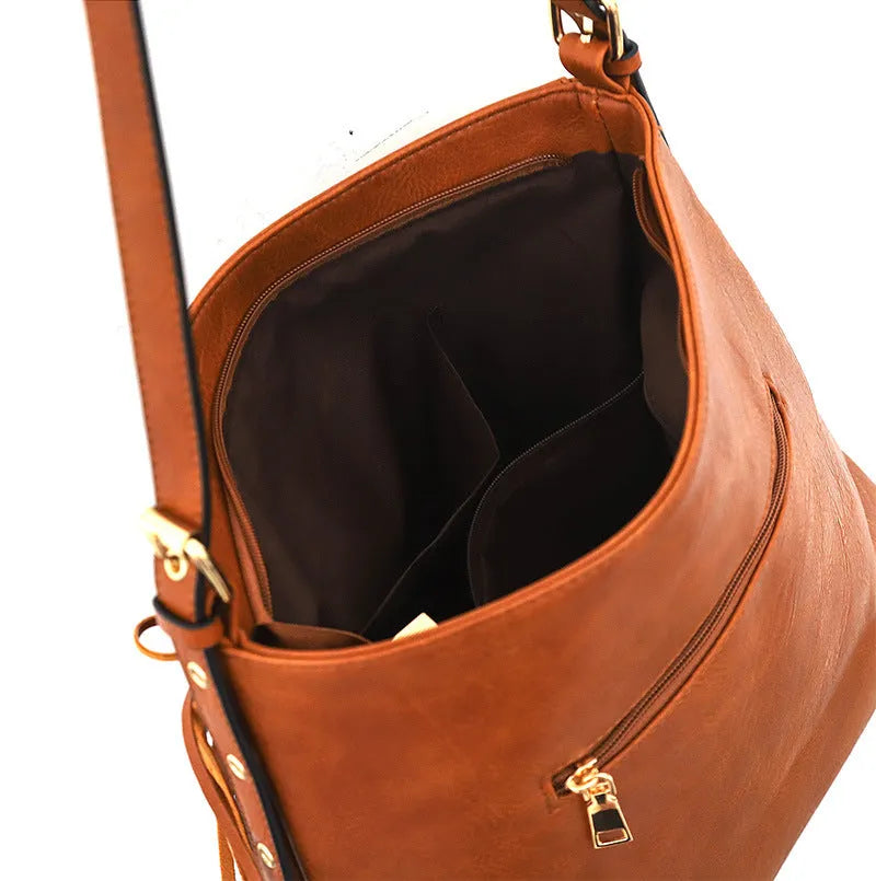 Large capacity soft PU messenger bag with rivet detailing, sandwich pocket, and long shoulder strap in brown colour