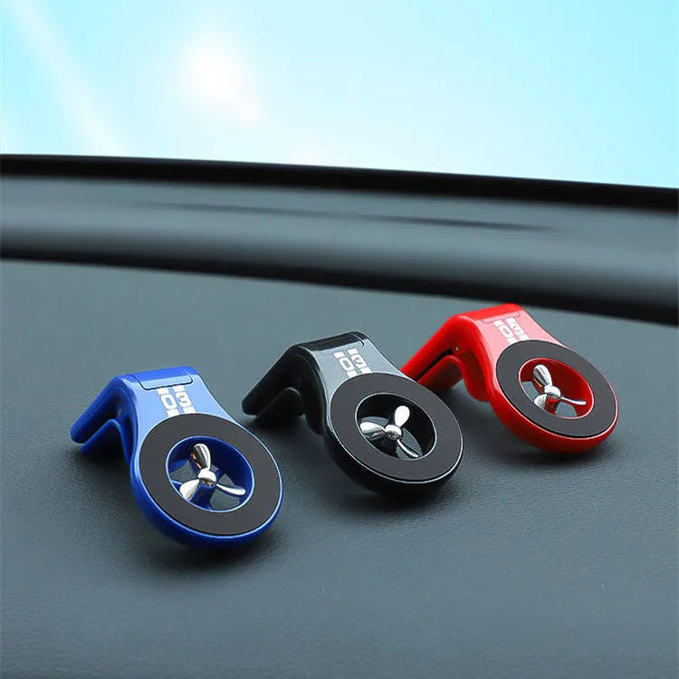 Magnetic car air vent phone holder with perfume diffuser in black, showing 360-degree rotation