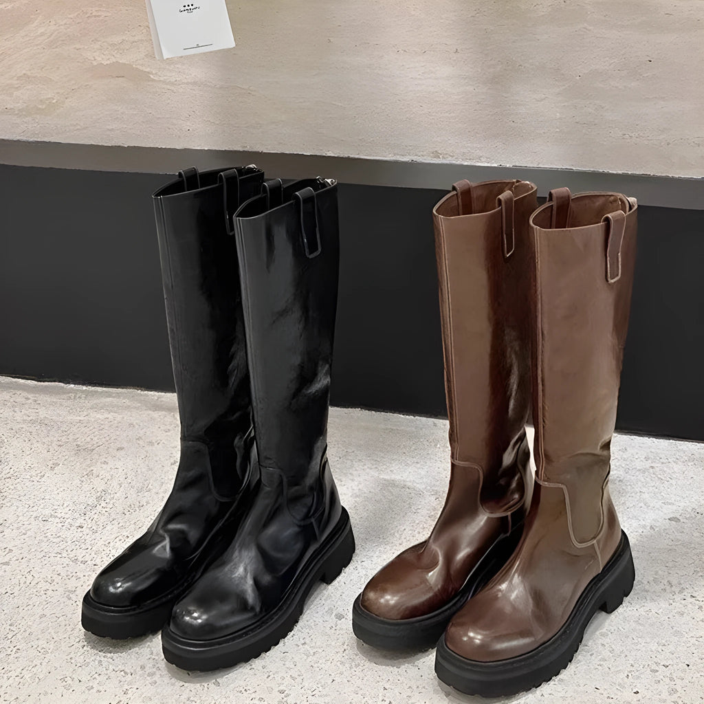 Women's black knee-high knight boots with a chunky heel, round toe, and back zipper.