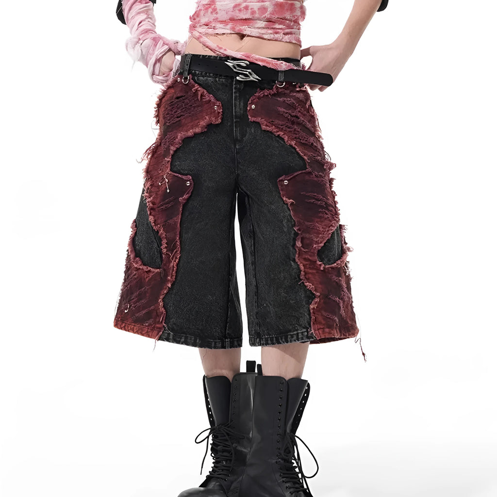 Distressed denim cropped pants with wide leg silhouette and brushed stitching details