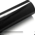 Glossy 3D carbon fiber veneer PVC film on a black surface showing realistic texture