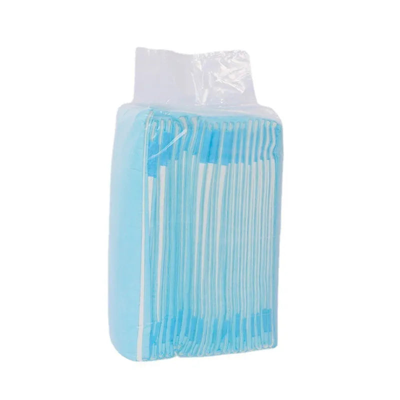 Disposable pet urinal pad for dogs with absorbent deodorant core in multiple sizes a pack of four pads on a floor