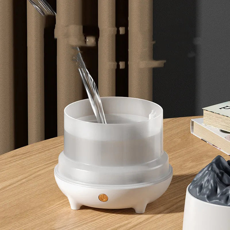 Round black volcano-shaped ultrasonic humidifier and aromatherapy diffuser with USB cable