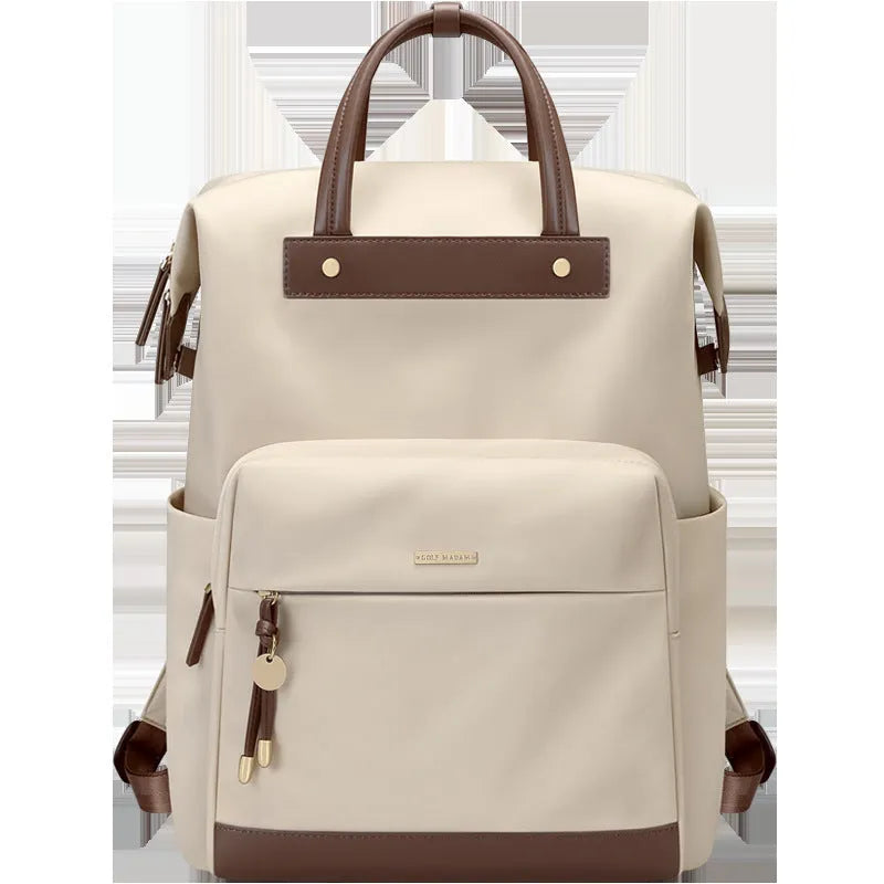 Women's large capacity backpack in apricot colour showing dimensions and adjustable shoulder strap