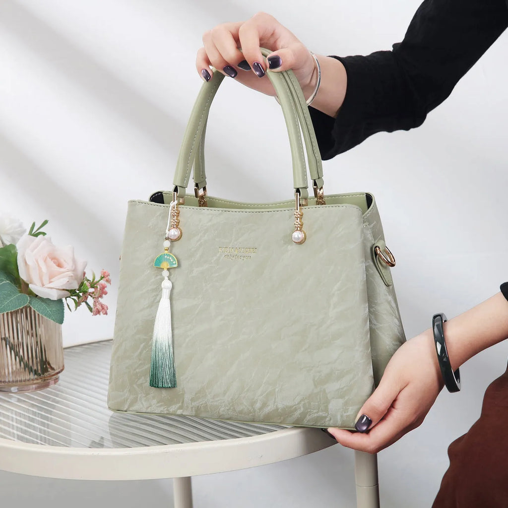 Women's square shoulder bag in PU leather with ethnic detailing and slit pocket