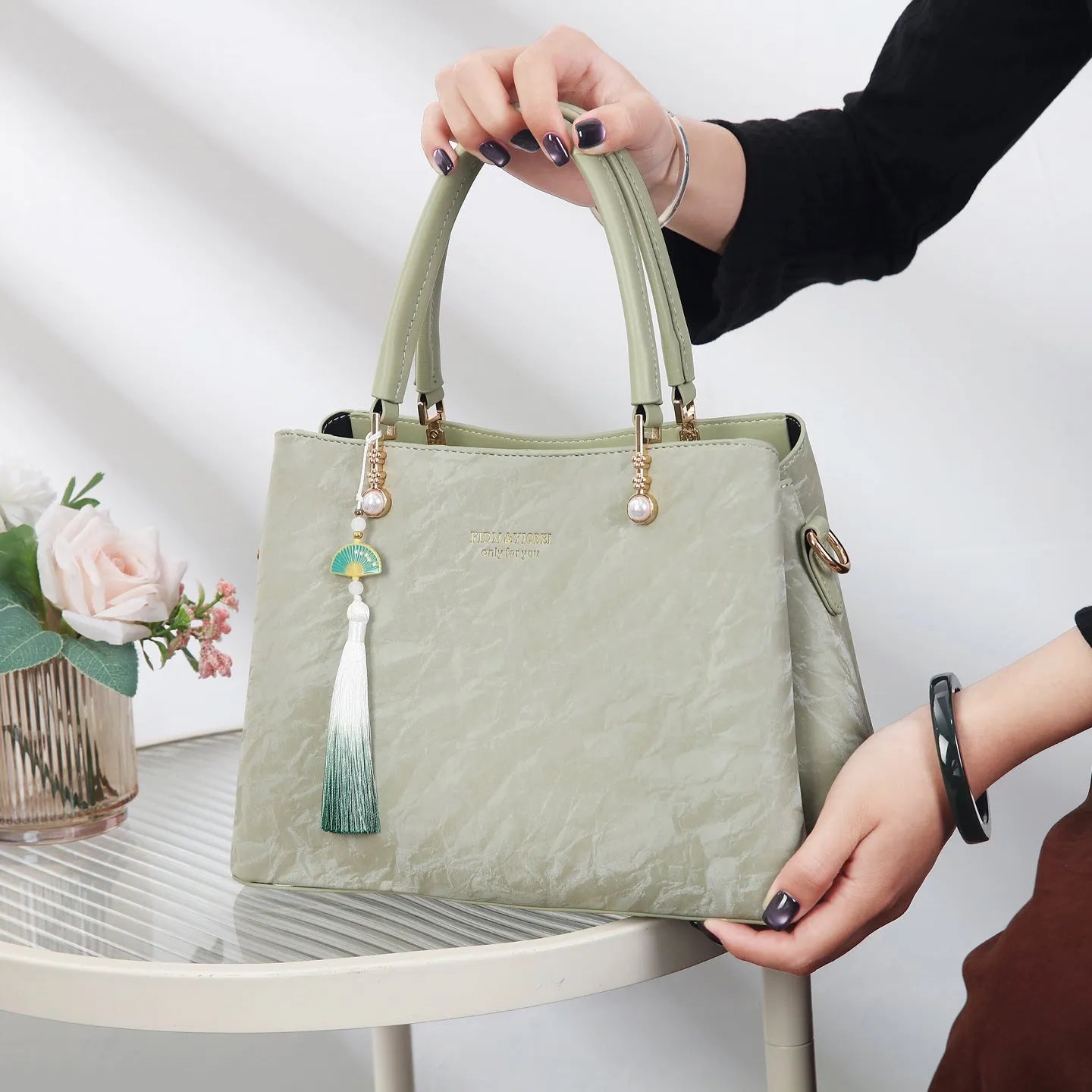 Women's square shoulder bag in PU leather with ethnic detailing and slit pocket