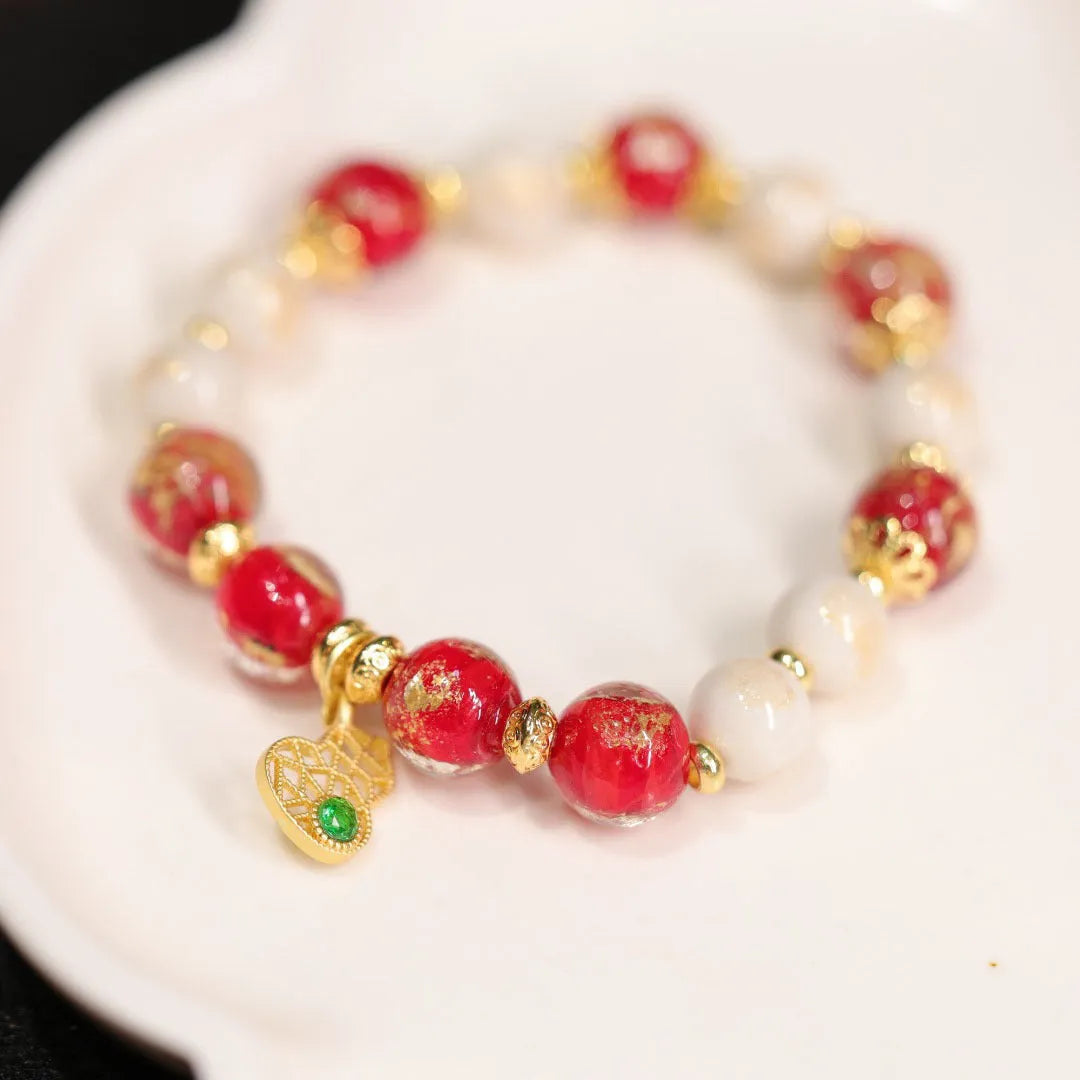 Women's geometric ethnic style bracelet with gold foil coloured glaze and manual glass construction