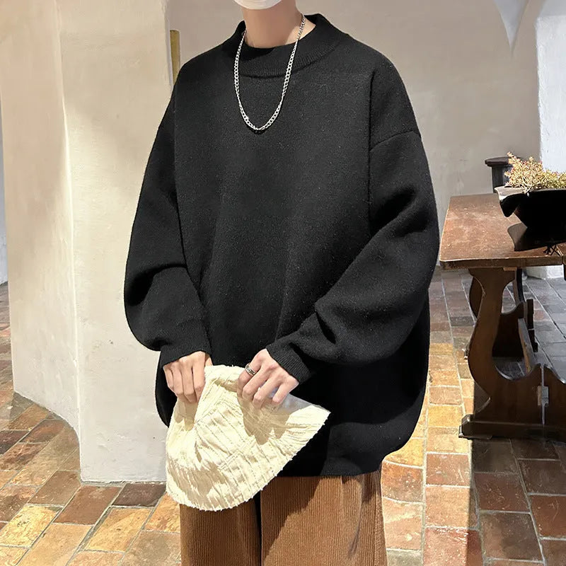 Men's loose fit round neck pullover sweater in a solid colour on a hanger.