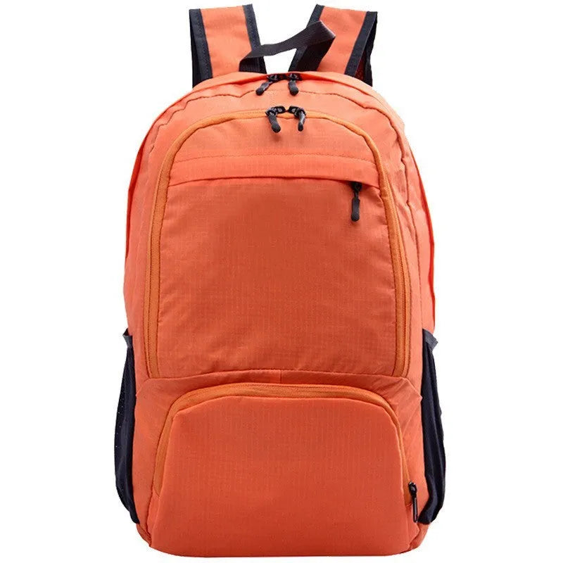 26 inch solid colour foldable backpack in Oxford cloth shown in black, blue, brick red, grey, green, orange, and purple.