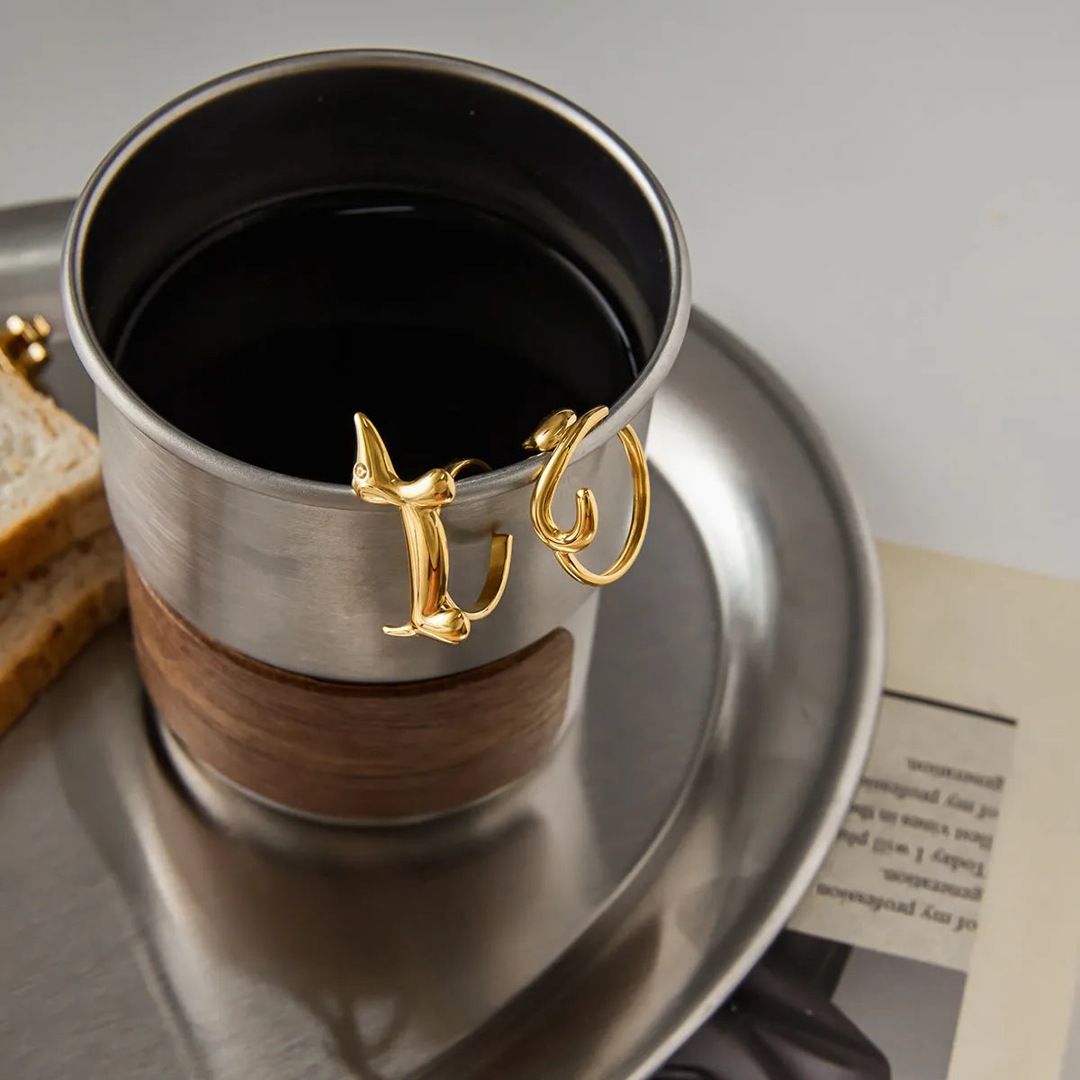 Niche design stainless steel ring with cat and dog geometric shape for women, electroplated finish, multiple colour options
