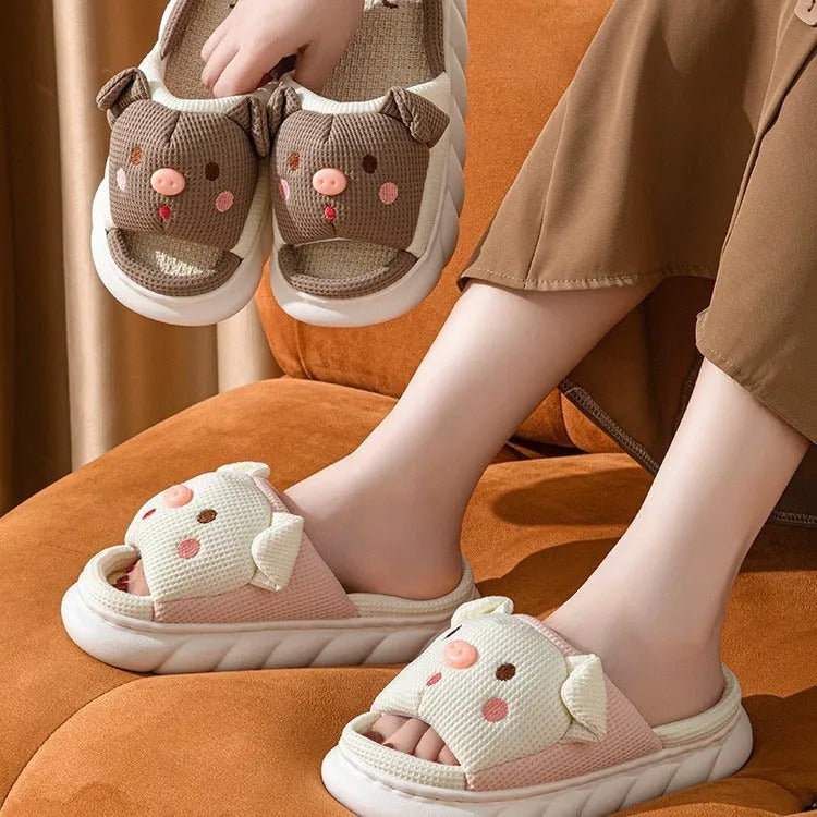 Piggy cute couple open toe linen slippers in pink colour on a white background.