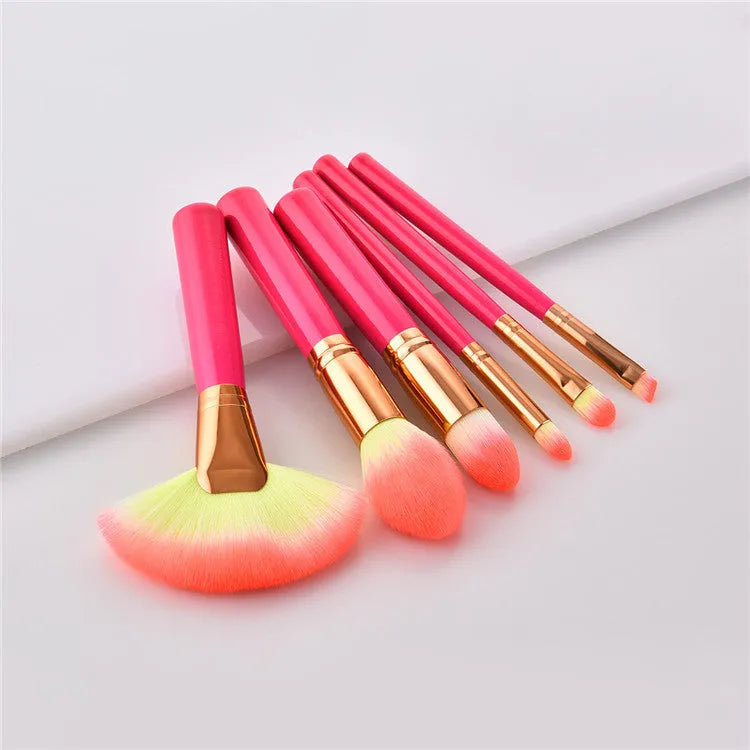 Pink wooden handle synthetic bristle makeup brush set in a compact case
