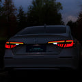 11th Generation Honda Civic modified LED taillight assembly with sequential streamer turn signals in black and red finish.