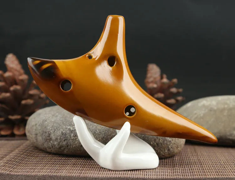 Yellow 12-hole ceramic ocarina in Alto C with 13-note C major range, integrated lanyard, bag and cable