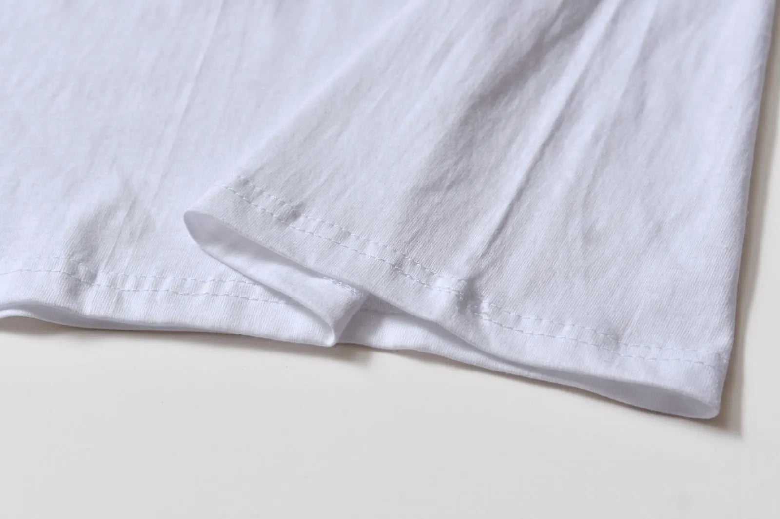 White cotton pattern overalls with short sleeves and loose pullover style