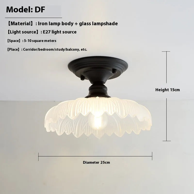 American retro style single-head ceiling or wall lamp with a glass cover.