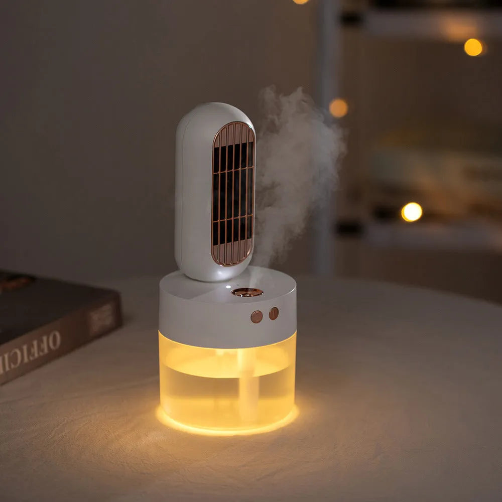 Small black and white humidifier fan with oscillating head on a table
