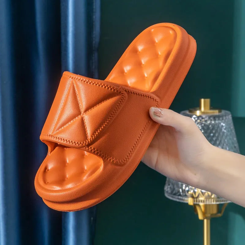 Pair of thick-sole EVA bathroom sandals in a chosen colour, showing soft upper and substantial non-slip base.