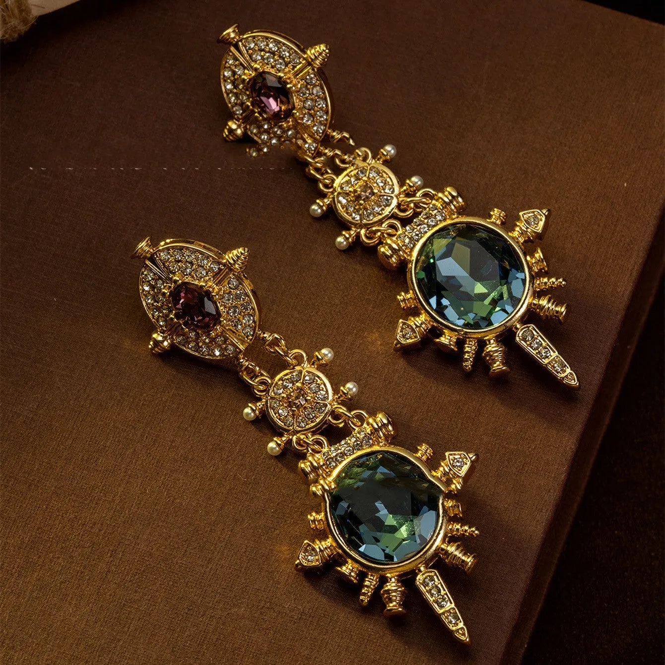 Gold geometric round stud earrings with diamond treatment surface detail