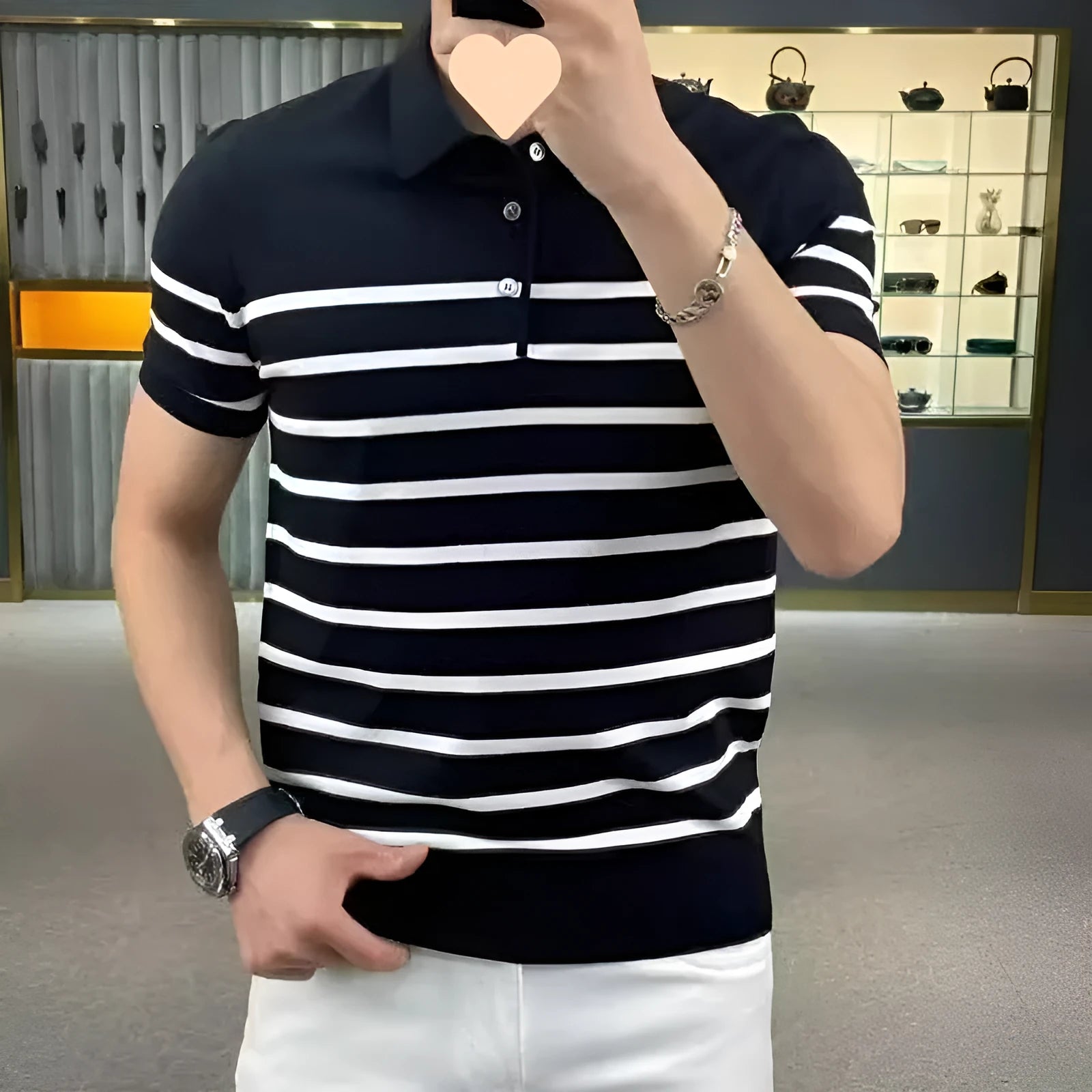 Black and white striped lapel pullover T-shirt laid flat, non-ironing polyester blend fabric.