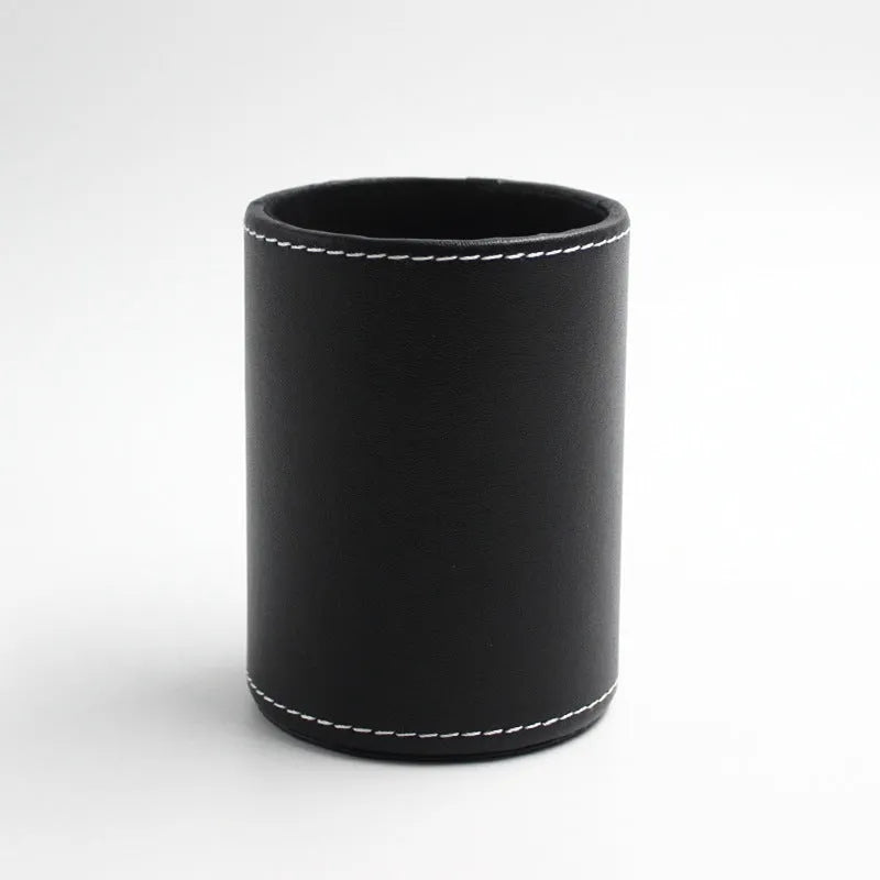 Black leather cylindrical pen holder measuring 8cm wide × 10.8cm tall on desk